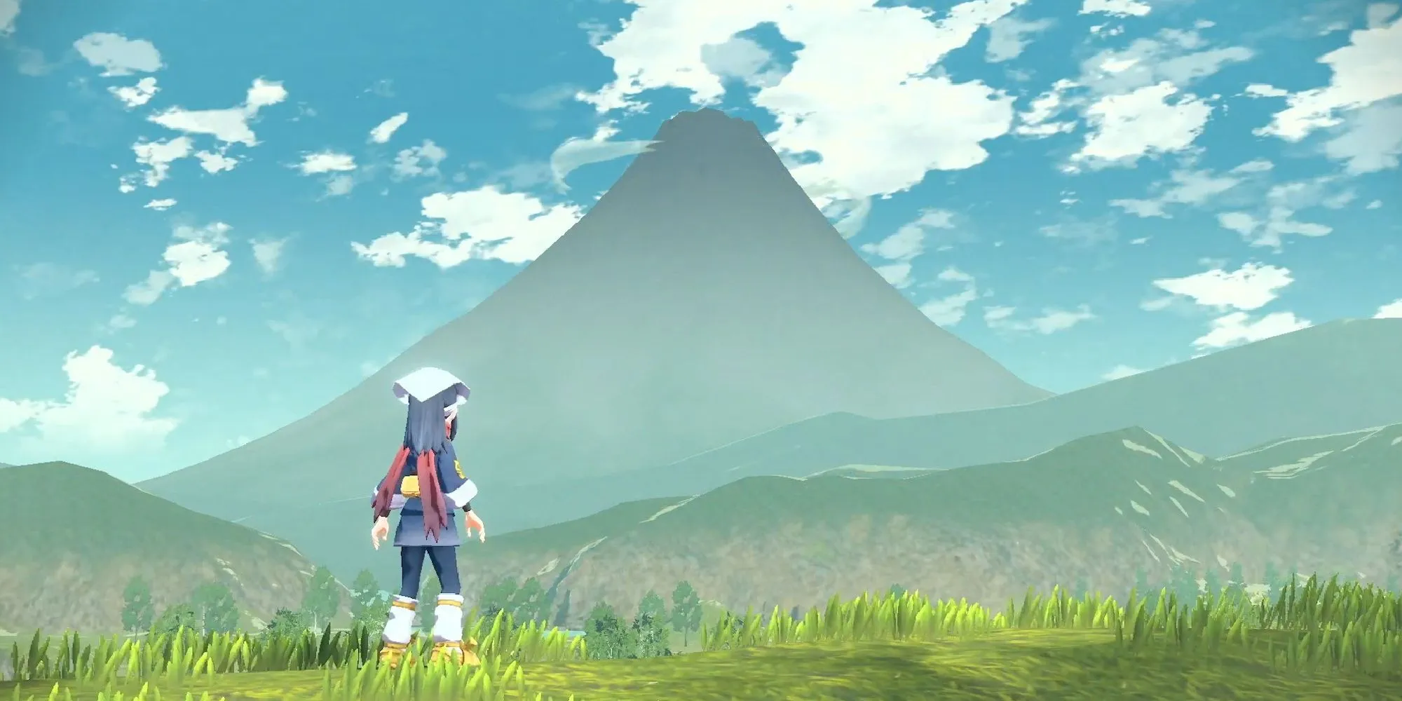 Gracz patrzący na górę Coronet pojawiającą się w Pokemon Legends: Arceus