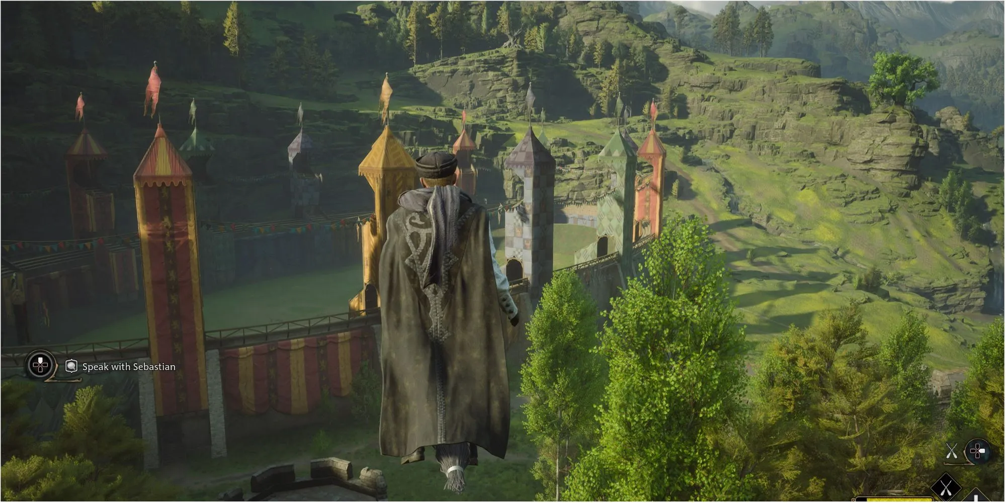W grze postać latająca na miotle i patrząca na boisko do quidditcha
